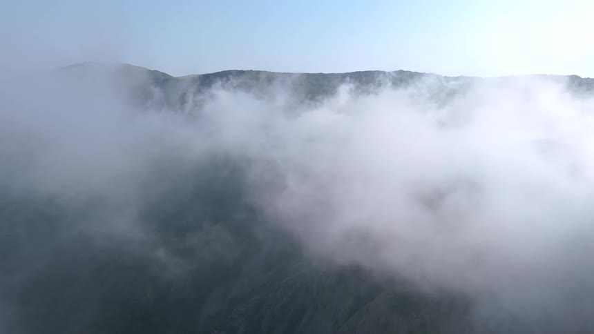 Aerial landscape of a sea of clouds near mountains