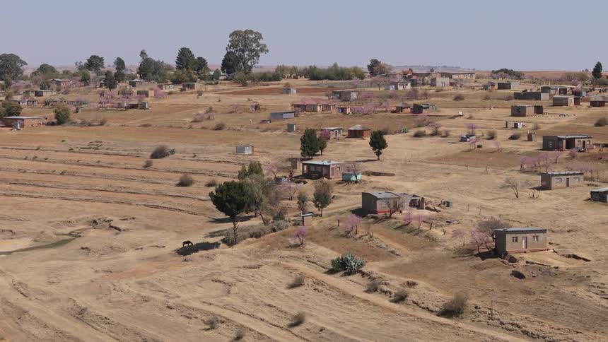 Aerial view of precarious houses in a semiarid terrain