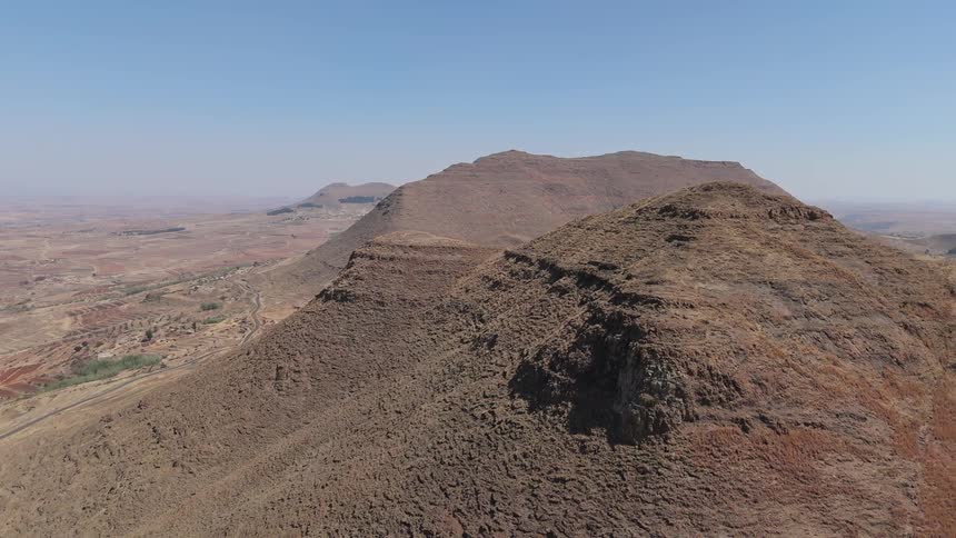 Aerial panorama of arid mountains in a valley