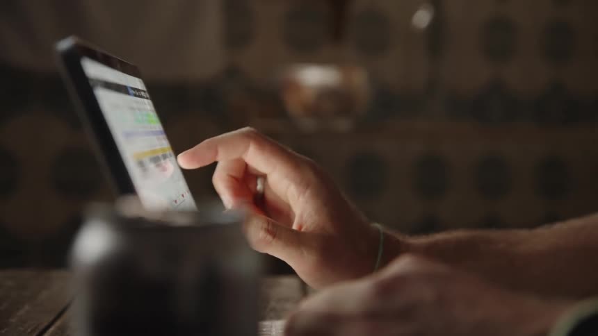A person scrolls through content on a tablets touchscreen