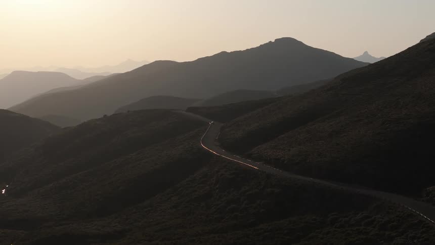 The mountain range is covered in fog