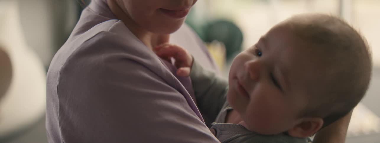 Mother with her baby in her arms