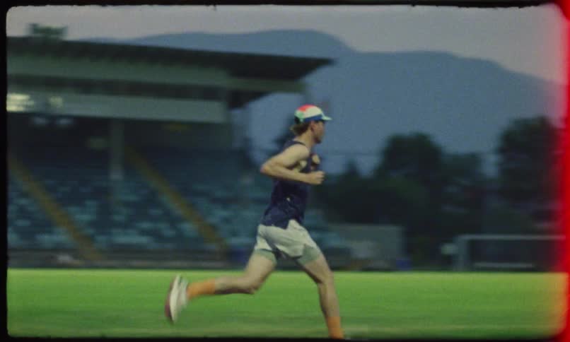 Man running on an athletics track