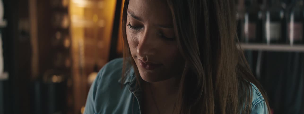 Portrait of a concentrated woman looking down