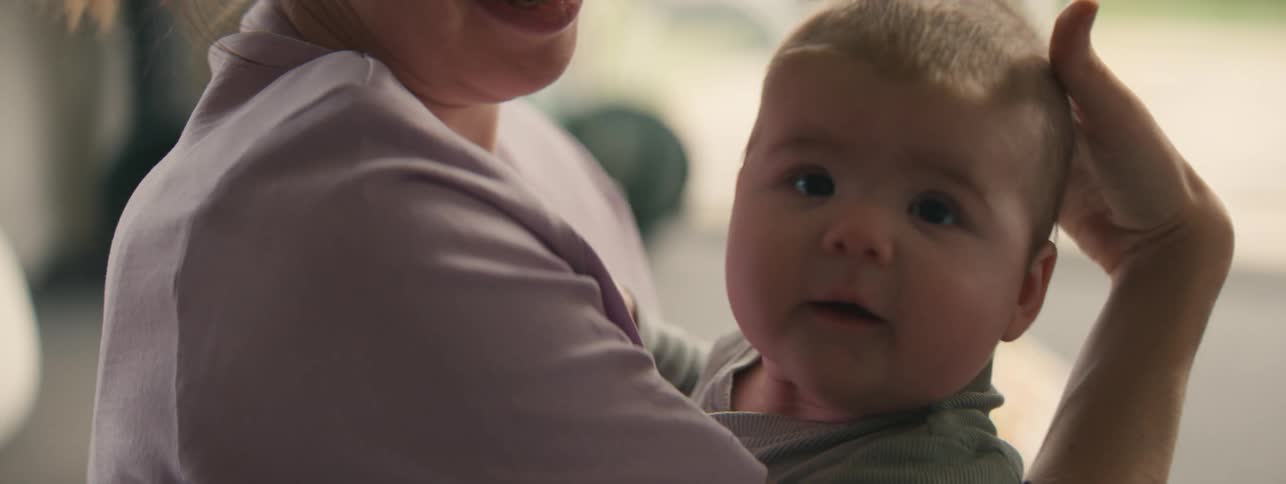 Close up of a mother holding a baby in her arms