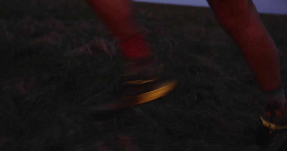 Legs of a person running on a hill