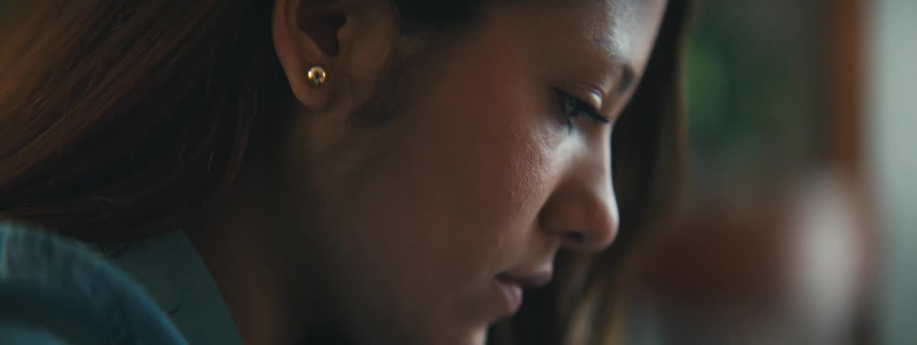 Side portrait of a concentrated woman
