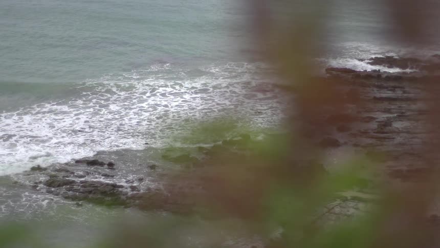 View of waves crashing on a rocky coast