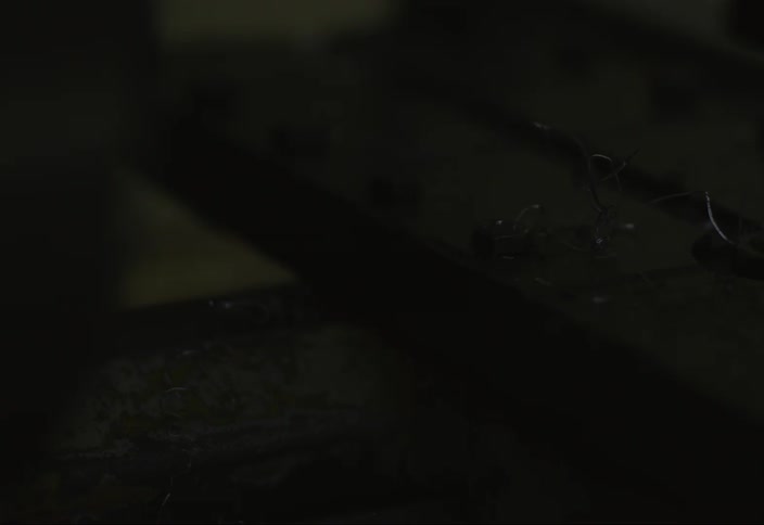 Bits of wire sit on top of a metal beam