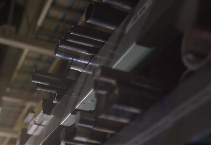 Closeup view of metal tubes of different diameters arranged in parallel