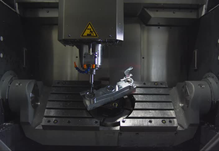 Robotic machine operating a metal object in circular motion