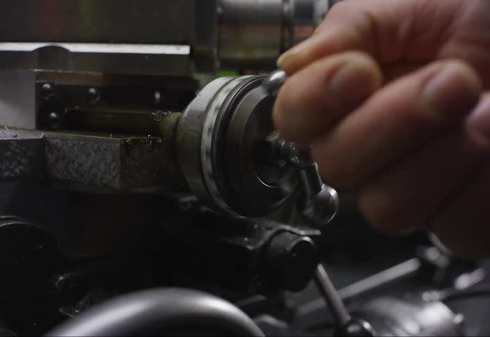 A metal bit is turned by hand