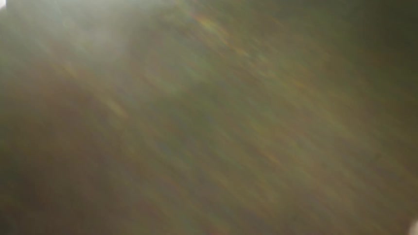 Extreme close up of an abstract object with sun reflection