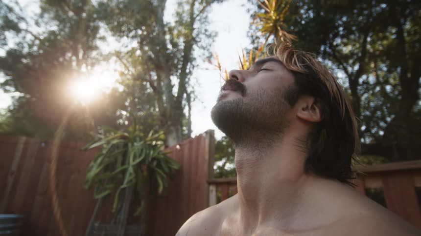 A man looks up at the sky