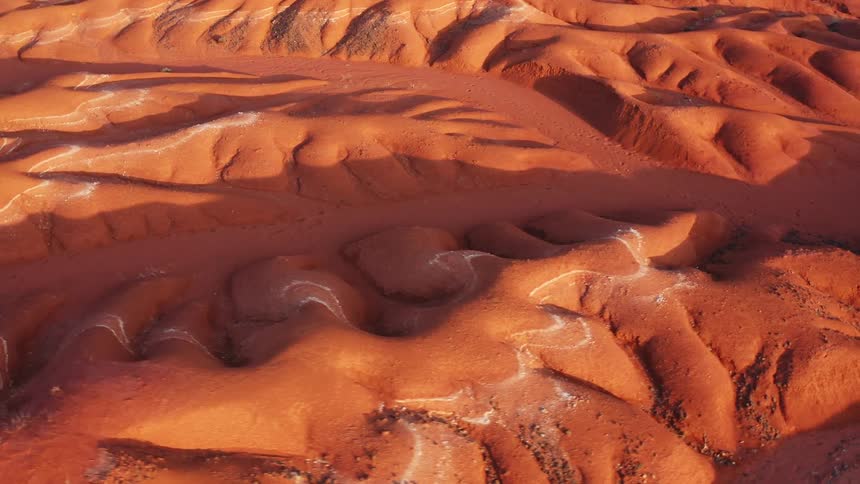 Large orange colored desert dunes in nature