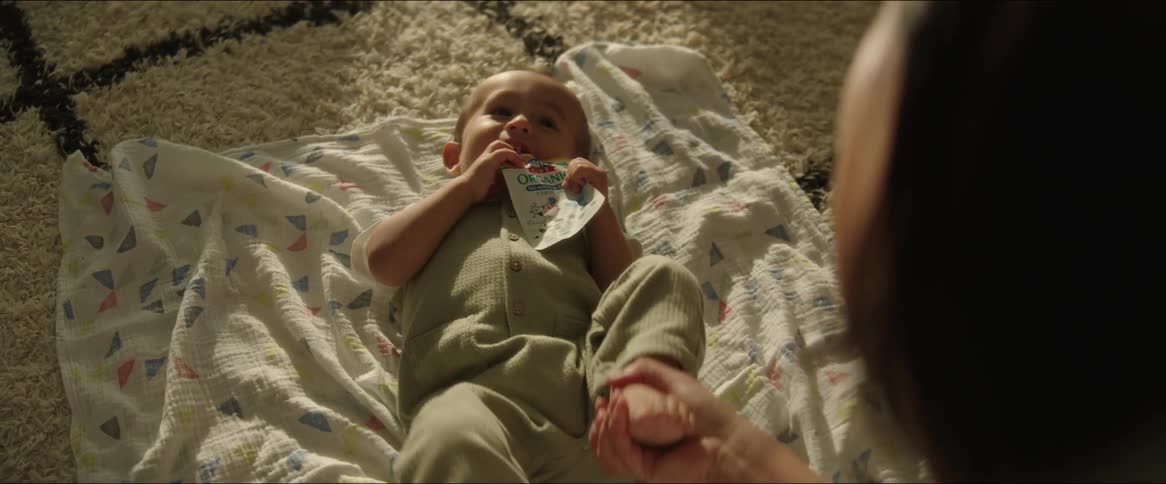 A mother playing with her baby