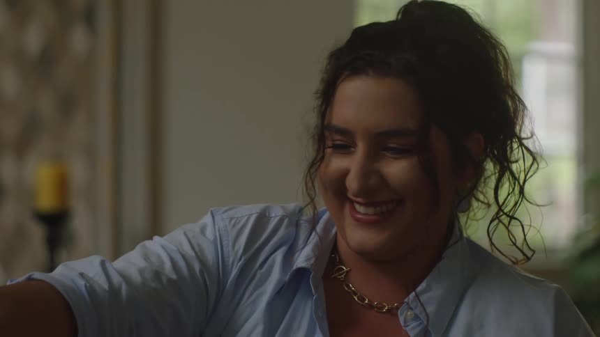 Portrait of a woman sitting smiling