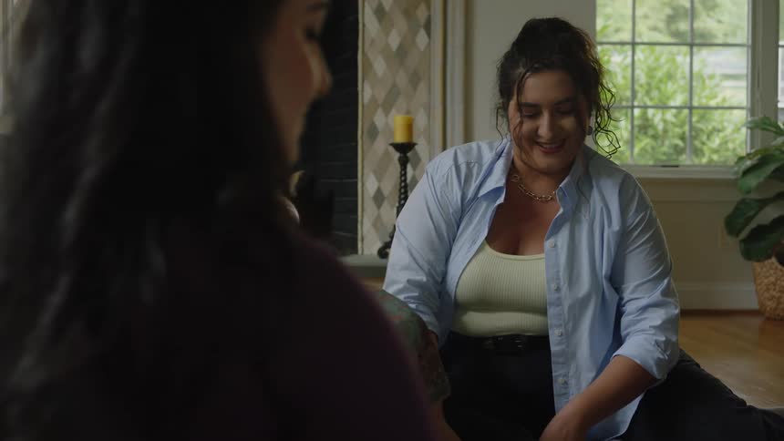 Two women put food on the table