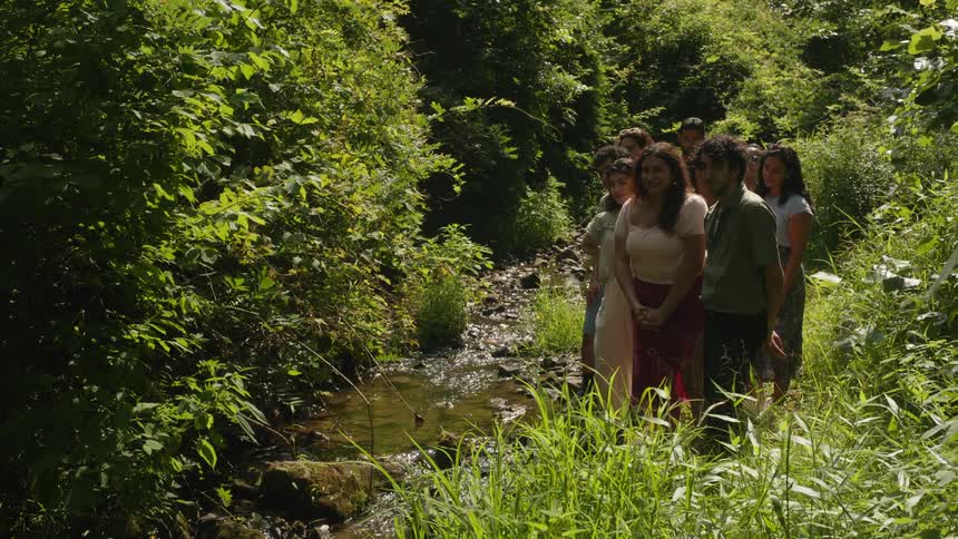 Group of friends in nature by the river
