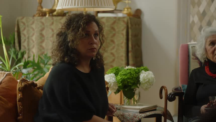 A clip of two woman sitting in the living room