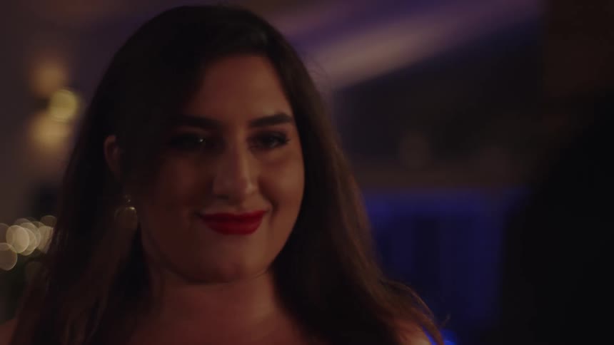Face of a happy madeup woman in a party salon