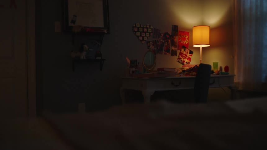Interior of a room with a lamp on