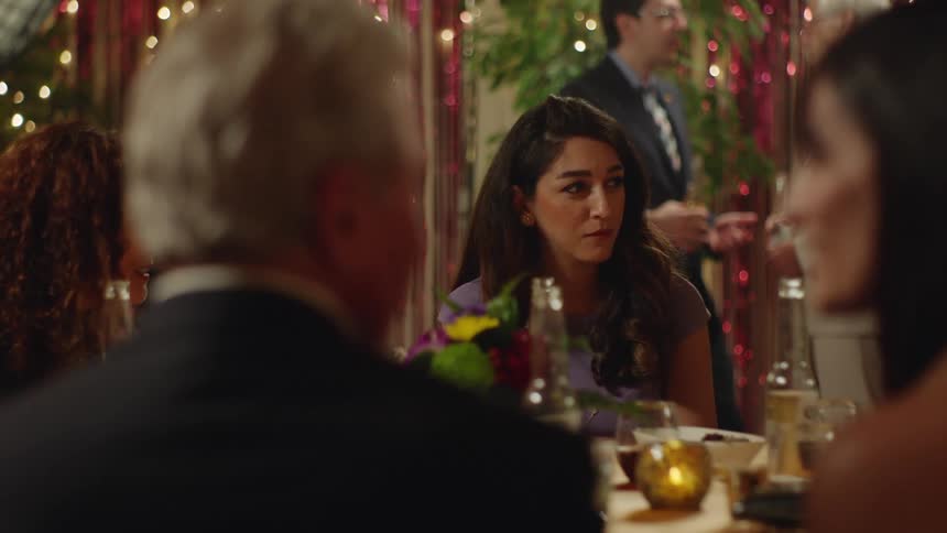 Four people enjoy themselves in a restaurant as they carry on conversations