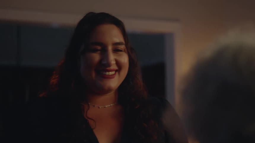 Portrait of a happy woman talking to an elderly woman