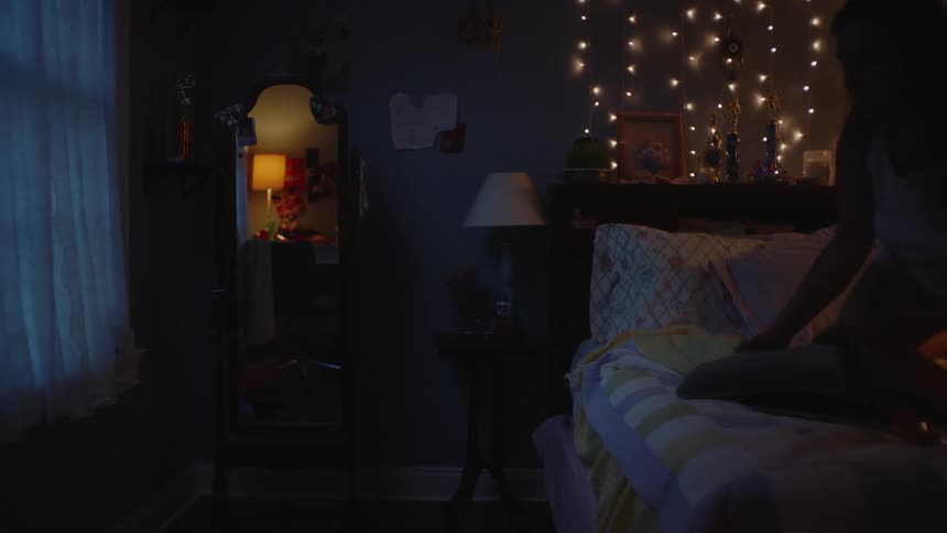 Woman in pajamas lying on the bed