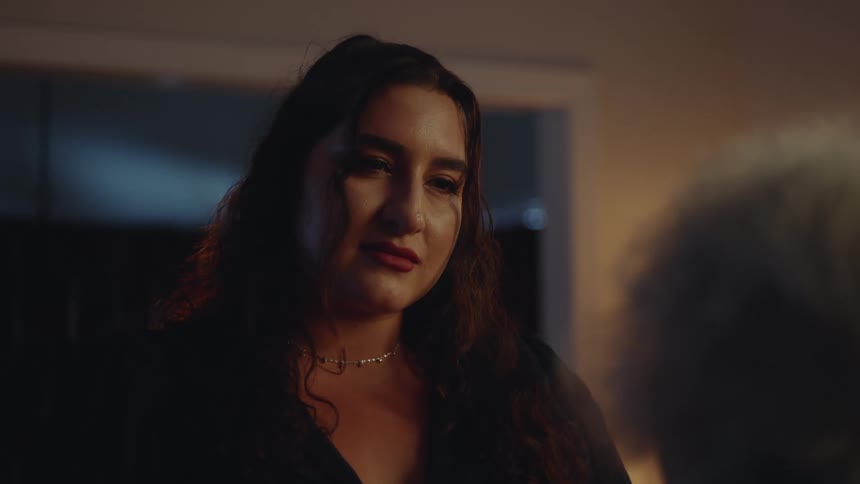 A woman is listening to someone talking