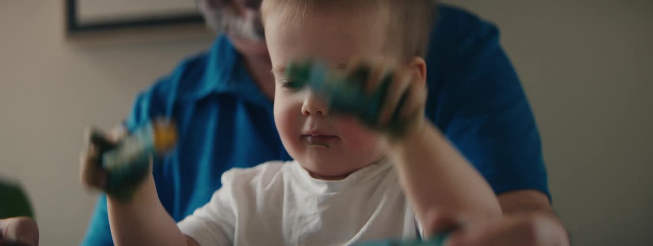 A clip of a son playing in front of the father