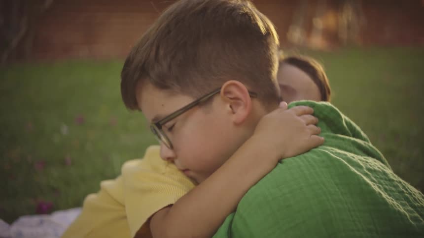 A clip of two brothers hugging