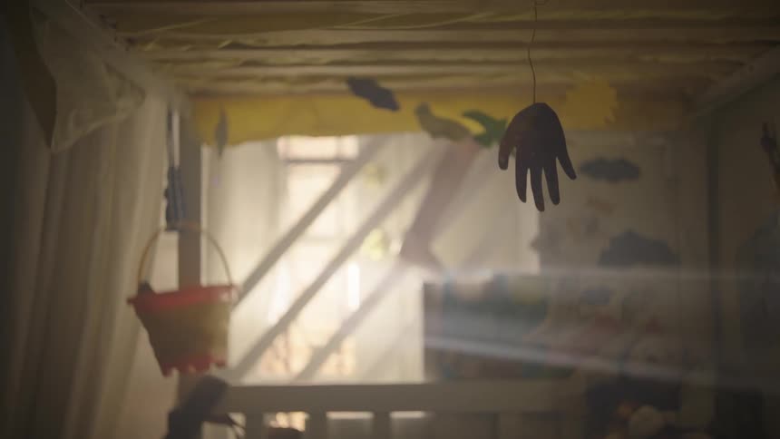 A young boy climbs stairs near a bunkbed
