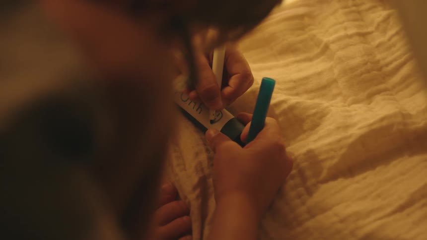 Child drawing a happy face