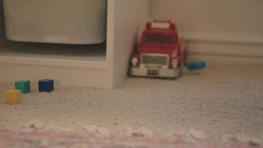 Toys falling on the carpet in the house