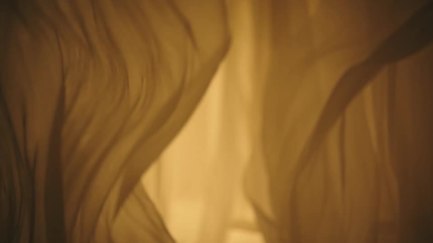 Moving curtain in a room