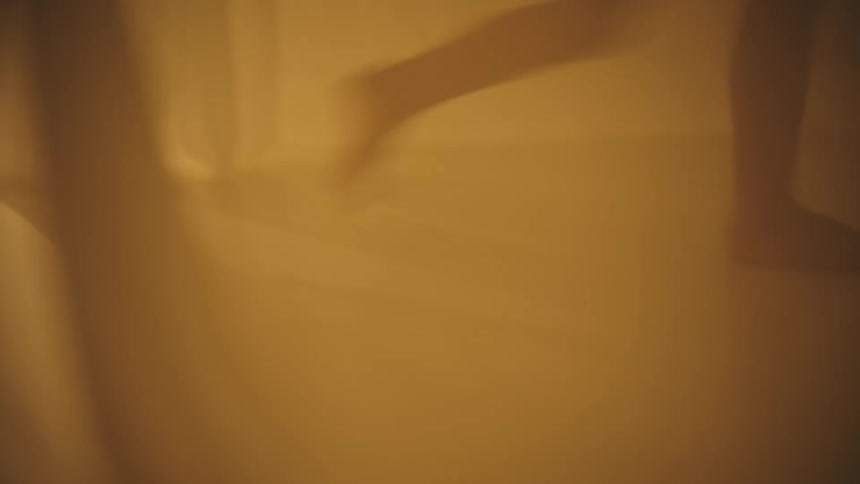 A person runs by in the fog