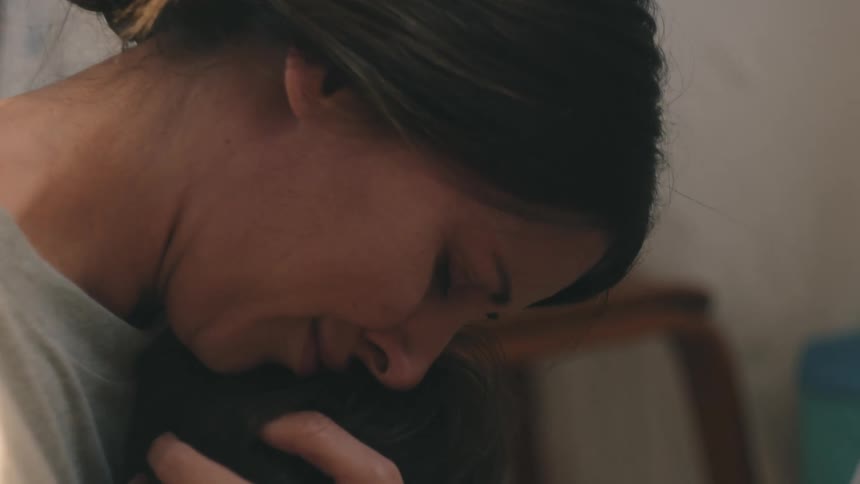 Mother hugging her little son