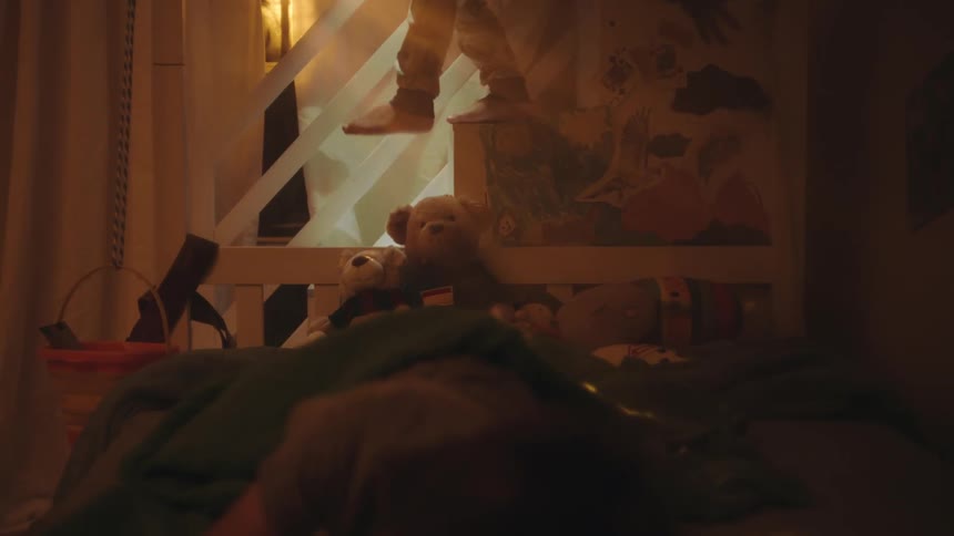 A child climbs in the window of the bedroom