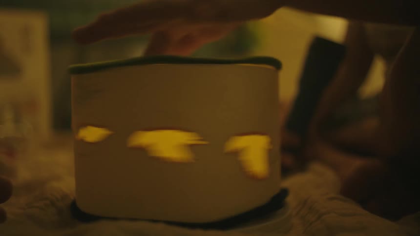 Childs hand interacting with a spinning toy