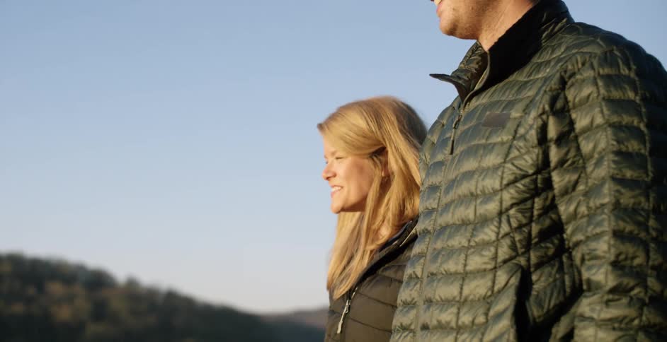 Man and woman standing outside looking at nature
