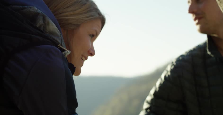 Woman and man climbing upwards in nature