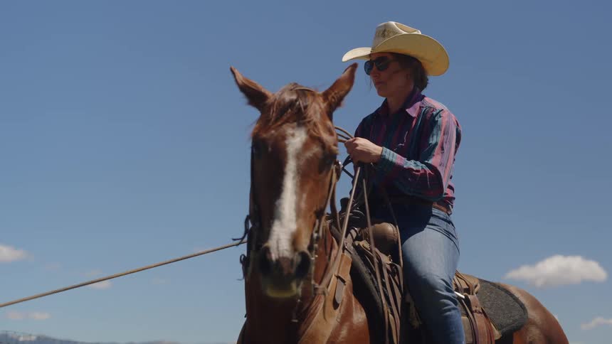 Woman sitting on a horse