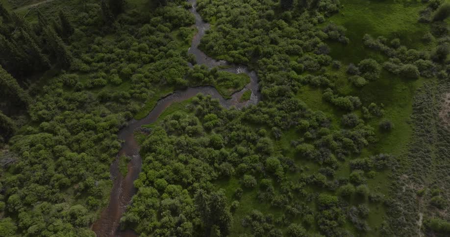 A winding river across a grass plain