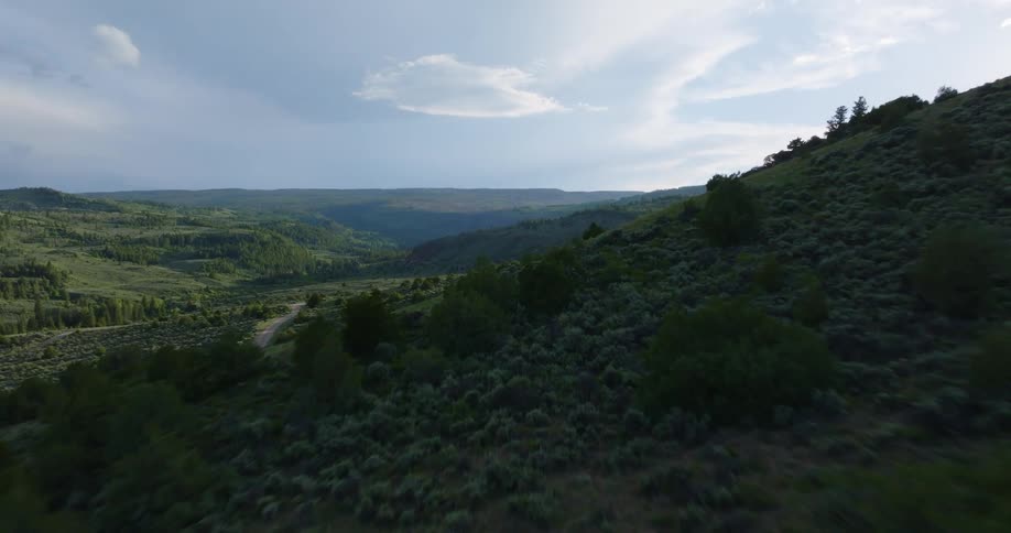 Aerial panorama of mountain ranges on a partly cloudy day