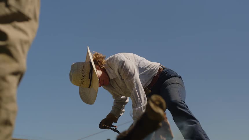 Concentrated woman using a tool that emits smoke