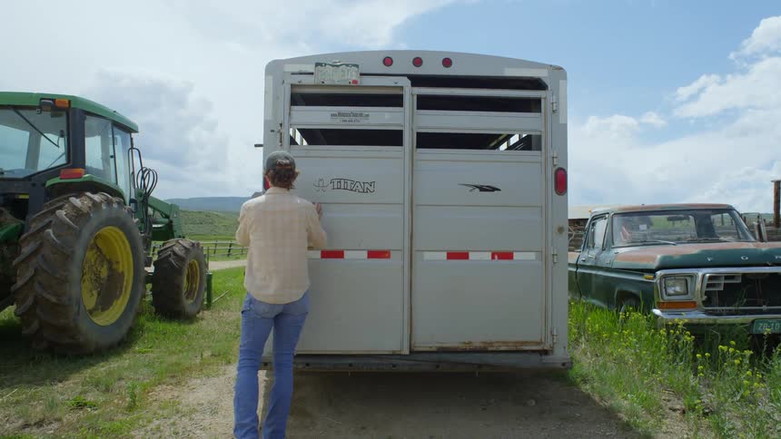 A clip of a lady closing a truck