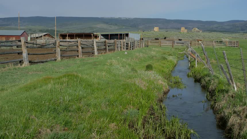 A creek passing by a ranch