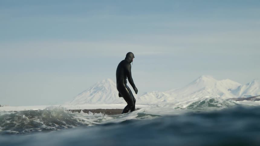 Person on surfboard in ocean