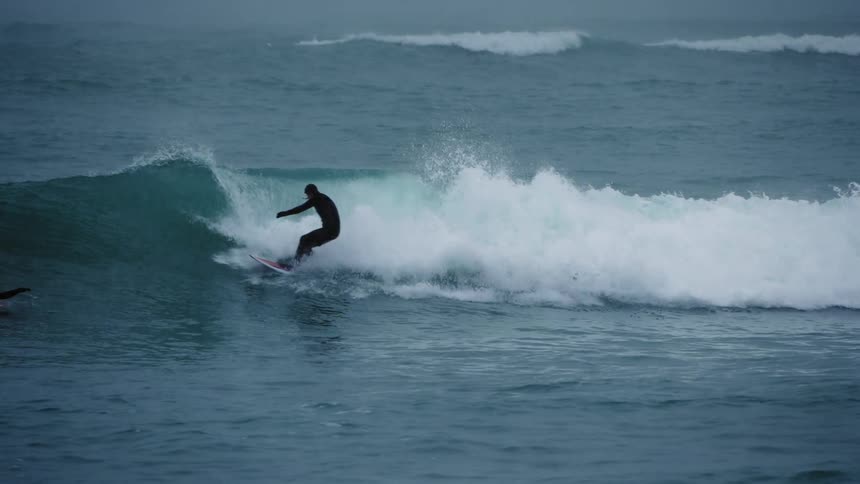 A clip of a person surfing the sea waves